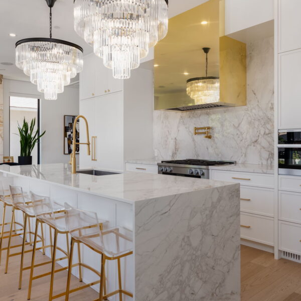 White kitchen with marble waterfall island, gold pendant lighting, and Miele appliances at 2305 W King Edward Ave, Arbutus, Vancouver
